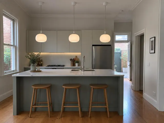Modern kitchen with three pendant lights over island in Camperdown